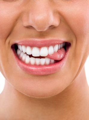 Manchas nos dentes: Conheça os sinais da erosão dentária